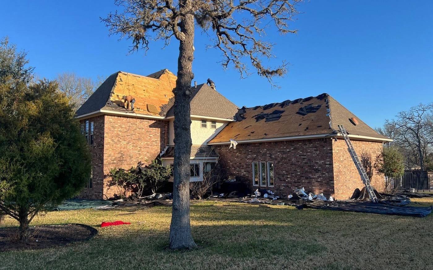 Trophy Exteriors roofing crew on a College Station job site