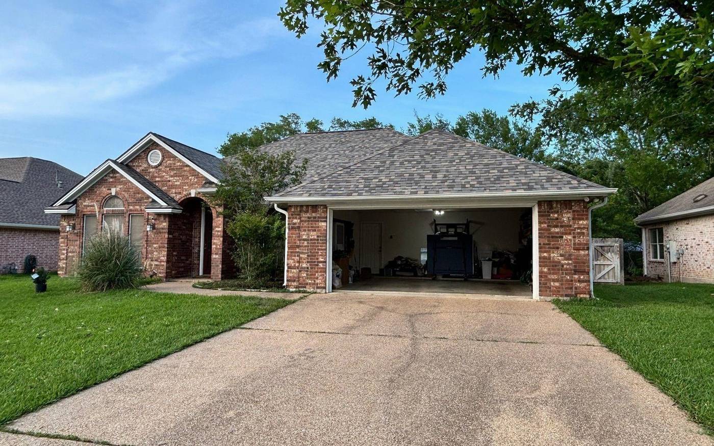 Trophy Exteriors roofing crew on a College Station job site