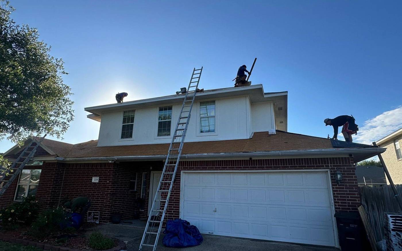 Trophy Exteriors roofing crew on a College Station job site